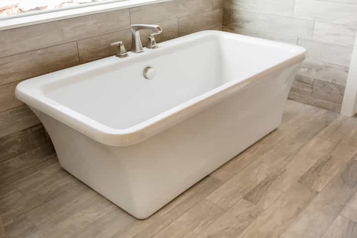 Professional bathroom remodeling experts install a luxury soaking tub in Lafayette, Louisiana home